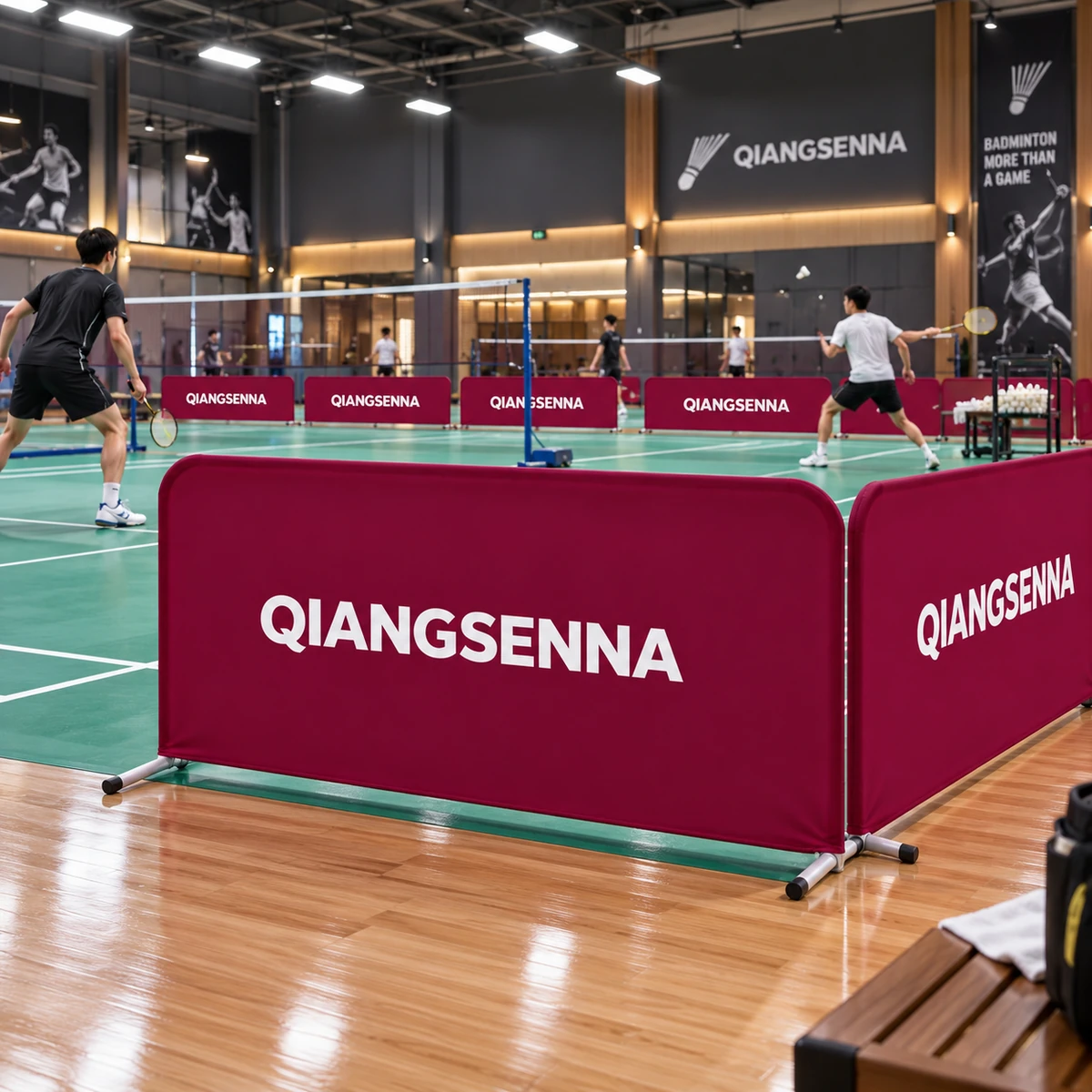 Burgundy QIANGSENNA barriers in an indoor badminton hall