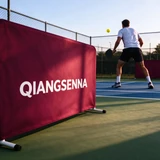 Burgundy QIANGSENNA barrier beside an outdoor pickleball player